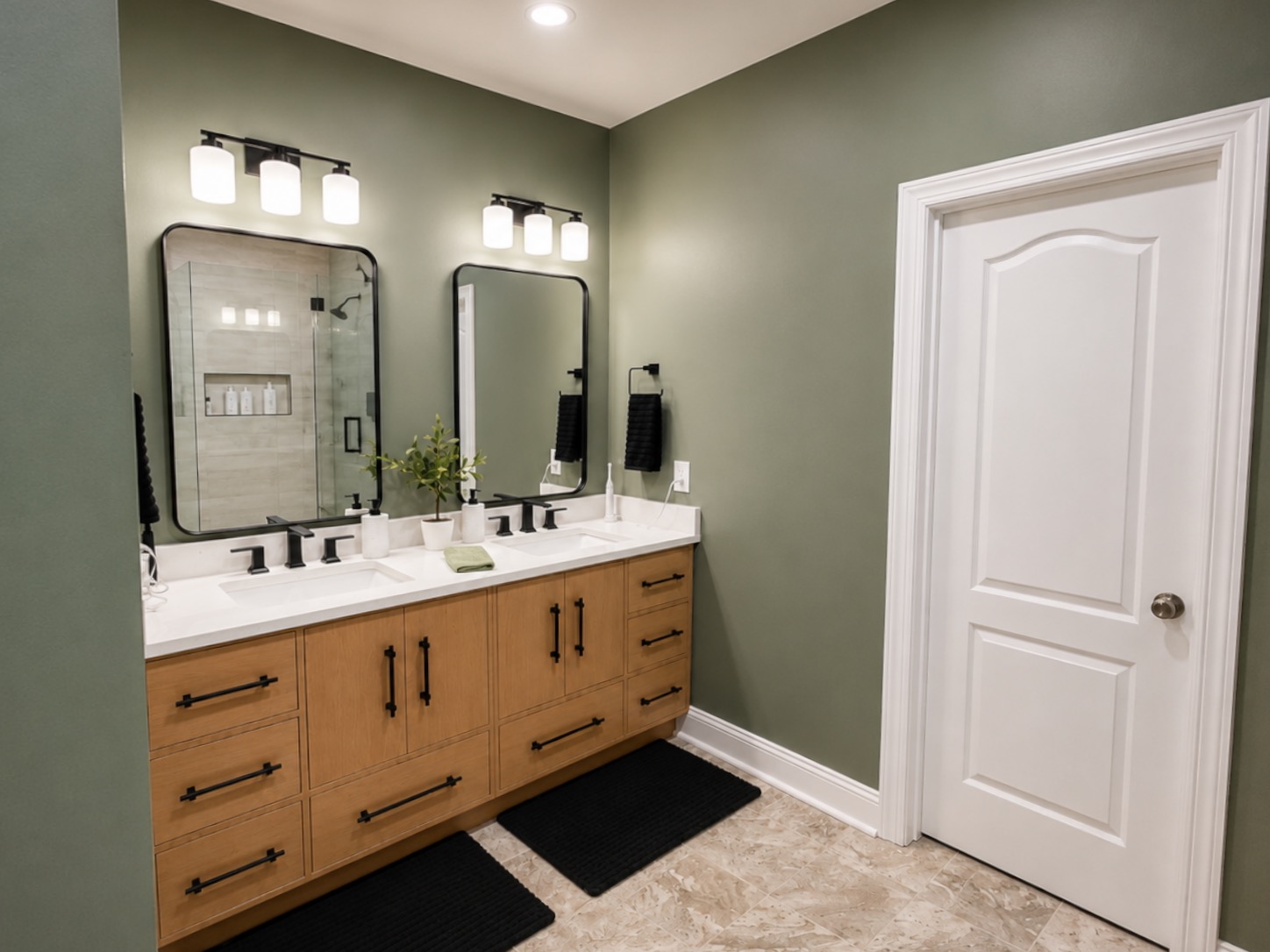 After — renovated bathroom with custom wood vanity and matte-black fixtures