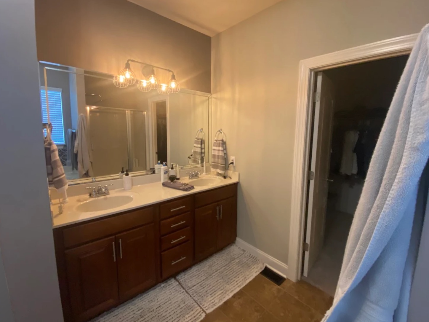 Before — dated bathroom with original cherry vanity