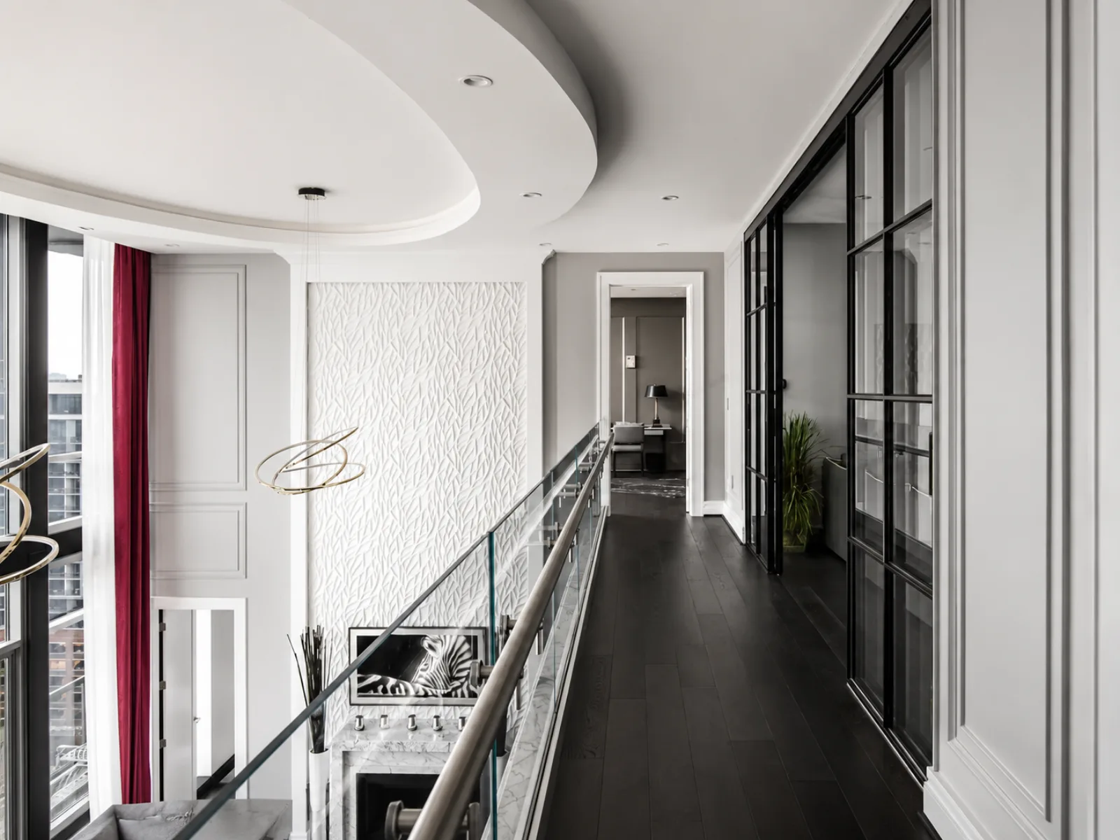 Mezzanine catwalk gallery hall with a glass rail and a red curtain